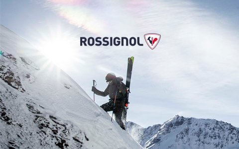 A couple with Osprey backpacks packing up after camping in rocky mountains